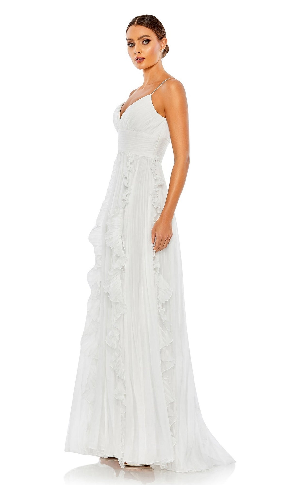 A woman wears the Ruffled Long White Formal Dress 49533, featuring thin straps, a V-neckline, ruffle details, and a classic A-line evening gown silhouette, shown against a plain white background.